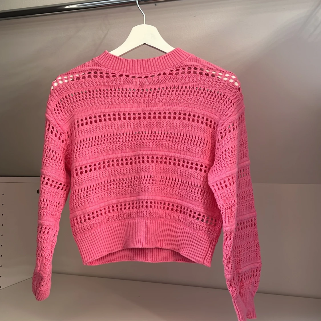 Rosa stickad tröja från H&M