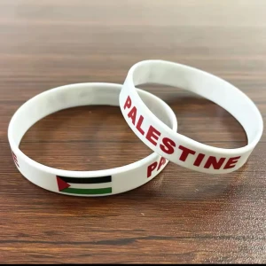 Palestine Bracelet - A bracelet with the text “PALESTINE” and the Palestinian flag