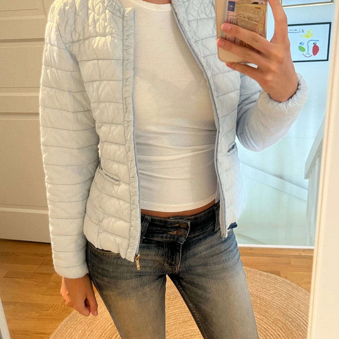 Ljusblå quiltad jacka