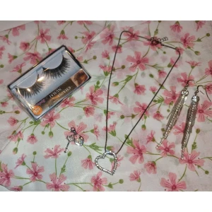 Smycken och Fransar - Ett par volymfransar (oanvända), ett silvrigt hjärthalsband (kedjan är missfärgad / inte äkta silver), en Berlock (helt ny / inte äkta silver), ett par örhängen (osäker på om det är äkta eller ej då jag fick dem i present / använda ett fåtal gånger)