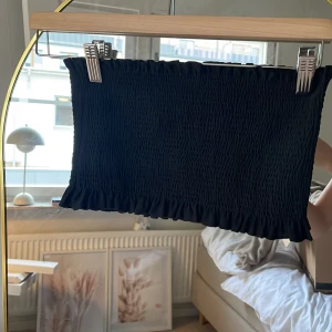 Svart bandeau - Svart ribbad badeau, aldrig används