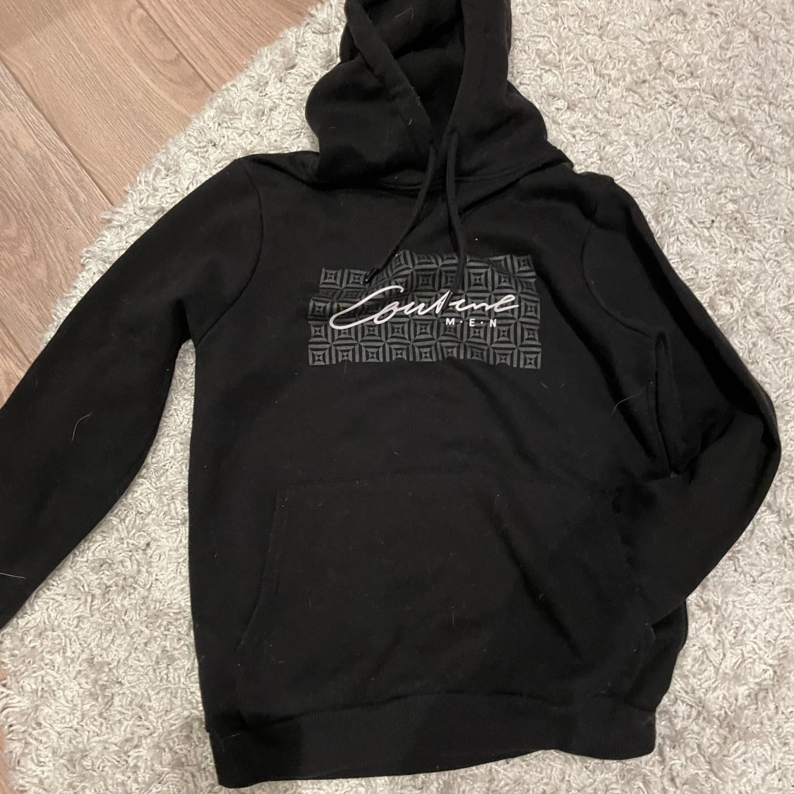Svart hoodie från Couture