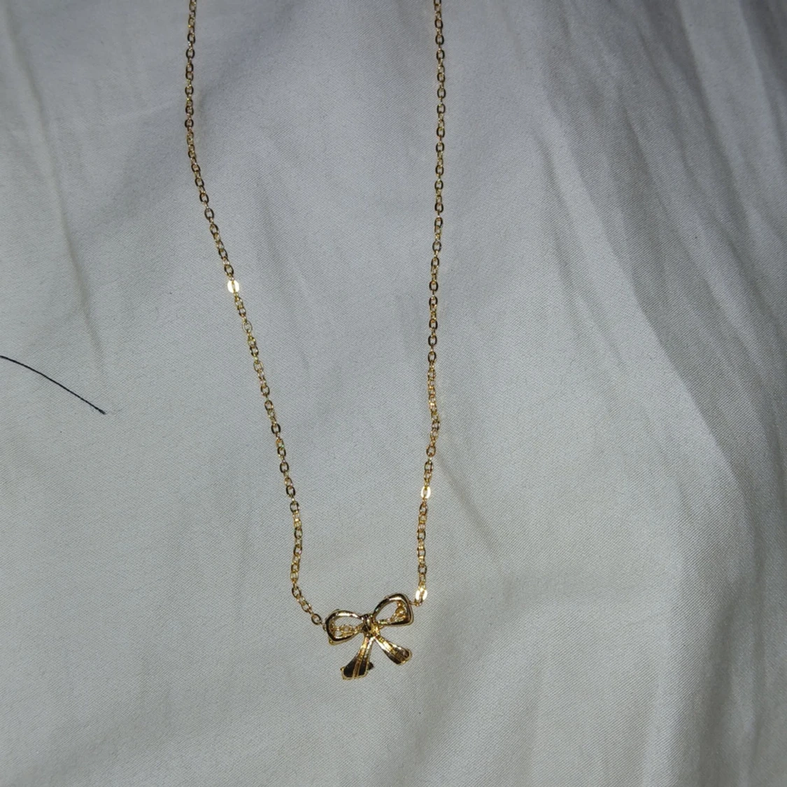 Guldhalsband med rosett