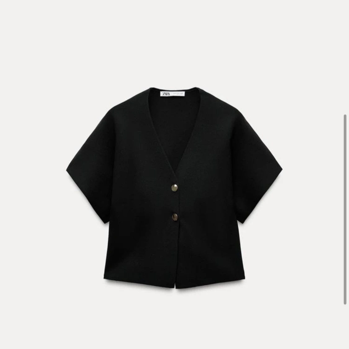 Svart v-ringad väst från Zara