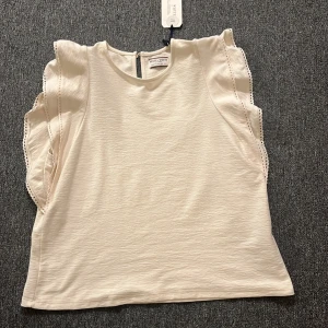 Lindex vit orange cotton tröja - En vit blus nästan som jag Bästelde de va fel storlek s:L