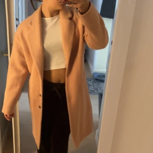 Lång vinter kappa - Lång vinterkappa  Jätte fin  Beige rosa aktig.