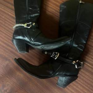 Vintage leather cowboy boots with chains 
