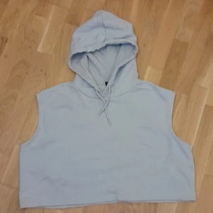 luvtröja - Stor ärmlös tjocktröja med luva