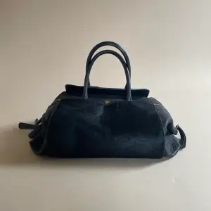 Rare Vintage MCM Designer Bag  Made in Italy  Luxury Black Leather with Black Ponyhair Frontal Pockets. MCM doesn’t make much Leather product today but this is a special piece using beautiful materials.  Please send any questions, cannot write much here