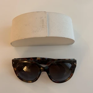 prada sunglasses  - authentic prada sunglasses. in good condition! 