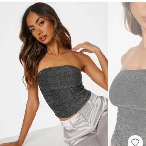 Festtopp - Glittrig tubetopp från bubbleroom med silikonband upptill. Superfin glittrig festtopp som passar perfekt för utgång. Säljs då den var lite för liten för mig. Stl S. Helt ny med prislapp kvar. 