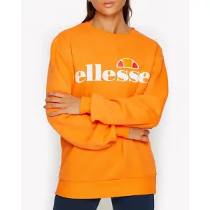 Orange oanvänd sweatshirt från elesse i storlek S