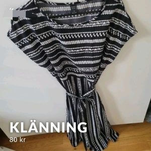 Oanvänd klänning  - Oanvänd klänning med knyte i midjan 