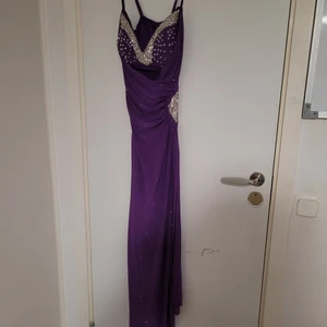 Fancy purple shimmer dress - The dress is used،but it is wearable.Beads are delicate and susceptive ‎to ‎move ‎from ‎it ‎place ‎(so ‎be ‎carful). ‏