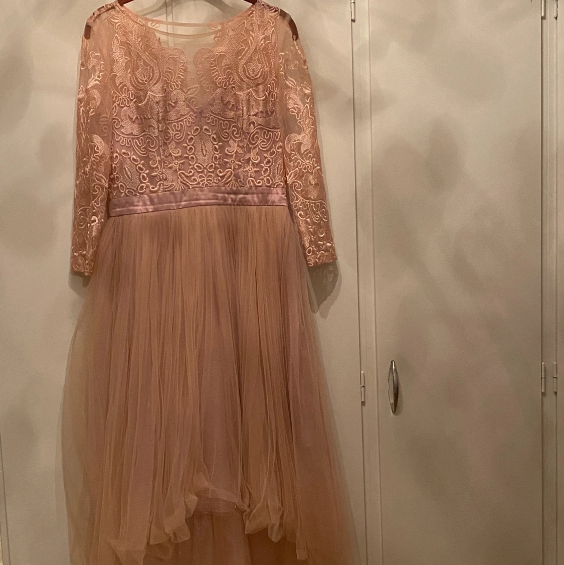 En rosa klänning i storken M