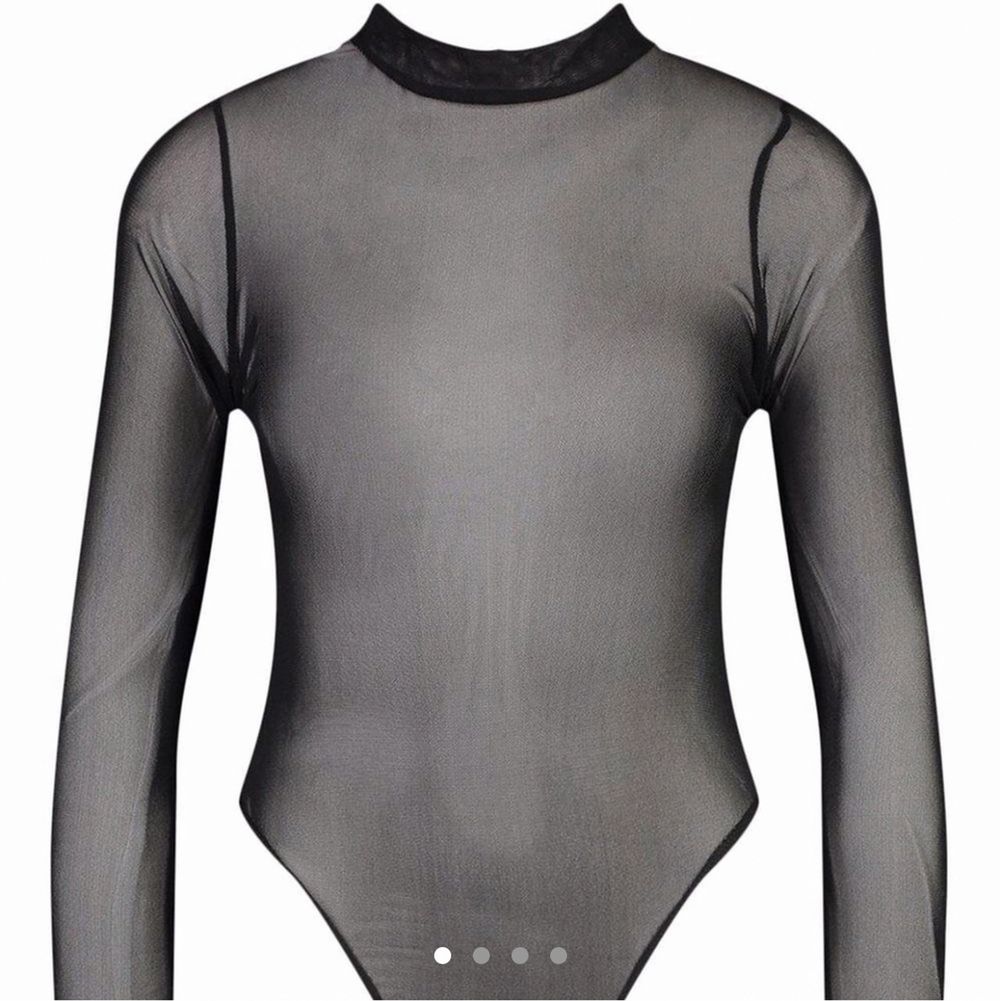 New with tags. Long sleeve black see thru mesh tulle high neck body suit with high cut bikini snap closure. Not really stretchy. Polyester elastane blend. Tag size US 6 UK 10 EU 38.  Brand new item. Made in UK. Happy to bundle. Will gladly take more pics.  Smoke and pet free storage space. No other flaws to note.. Övrigt.