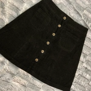black skirt  - Short black skirt. Type of material shown in second picture. Worn once. Made in Romania 