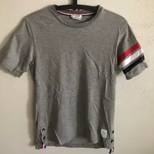 Women’s Thom Browne Classic Striped T-Shirt  Size small, regular small fit.  Excellent condition, no flaws or damage.  DM if you need exact size measurements.   Buyer pays for all shipping costs. All items sent with tracking number.   No swaps, no trades, no offers. 