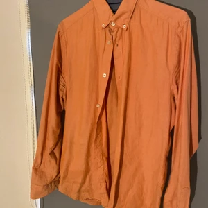 East west  - Persikafärgad skjorta i använder skick 