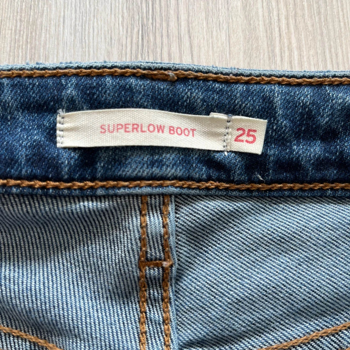 Superlow bootcut jeans blå, stl 25 - 2
