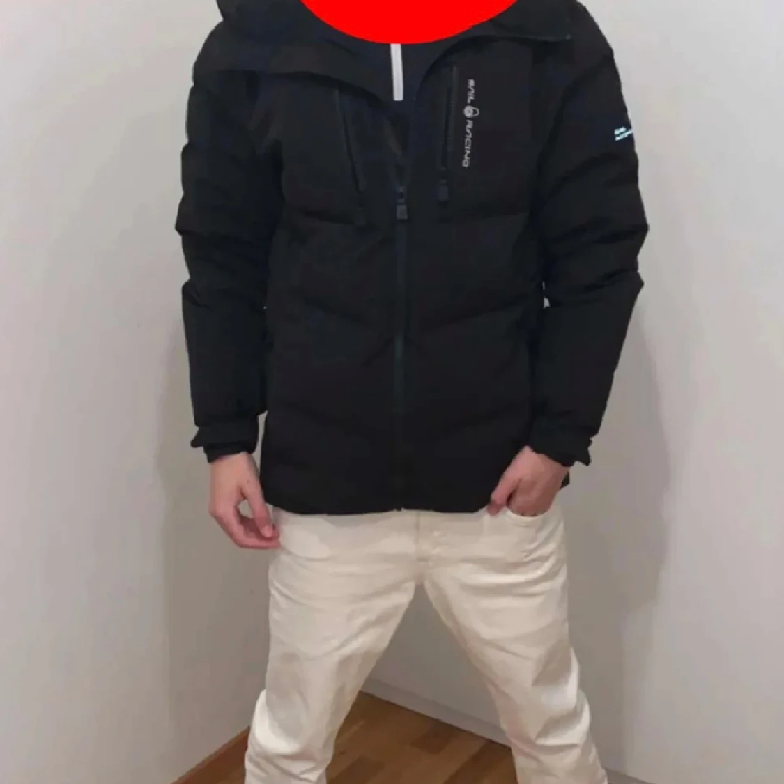 Svart pufferjacka från Sail Racing XS