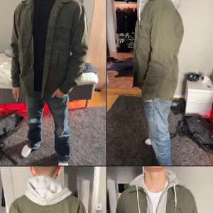 Olivgrön overshirt med fickor - Säljer en olivgrön overshirt från carhartt med  flera praktiska fickor framtill och knäppning med knappar. Jackan har en avslappnad passform och är tillverkad i bomull, perfekt att slänga över en hoodie för en chill look.