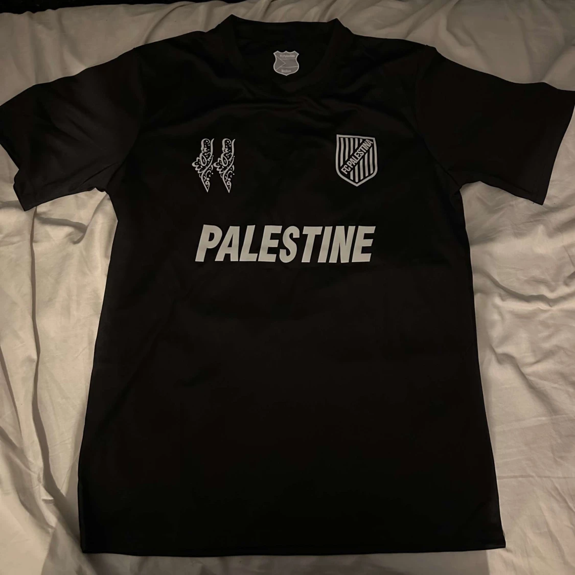 Svart fotbollströja från FC Palestina