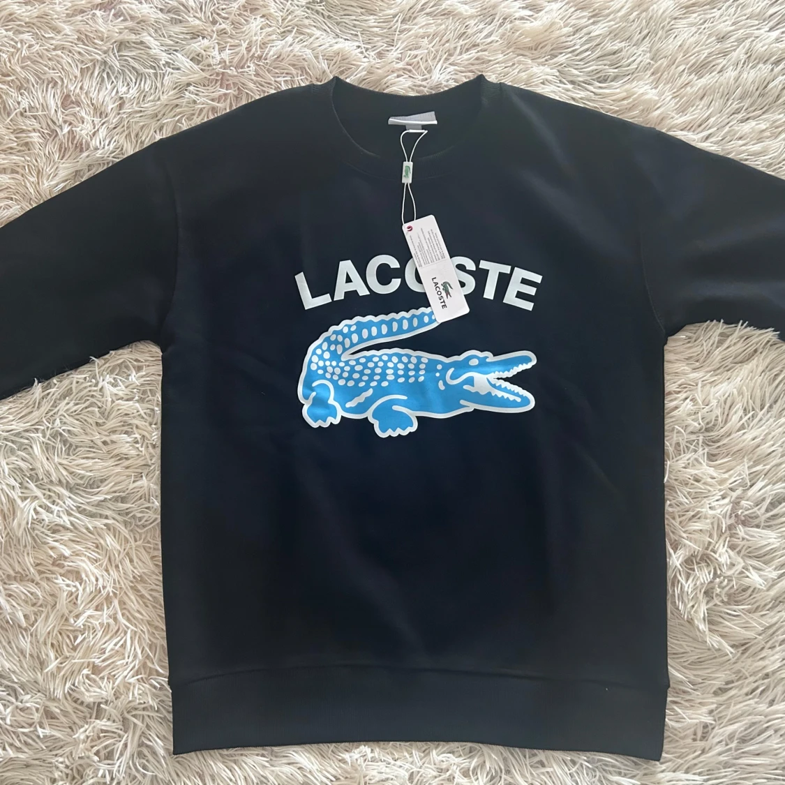 Svart sweatshirt från Lacoste