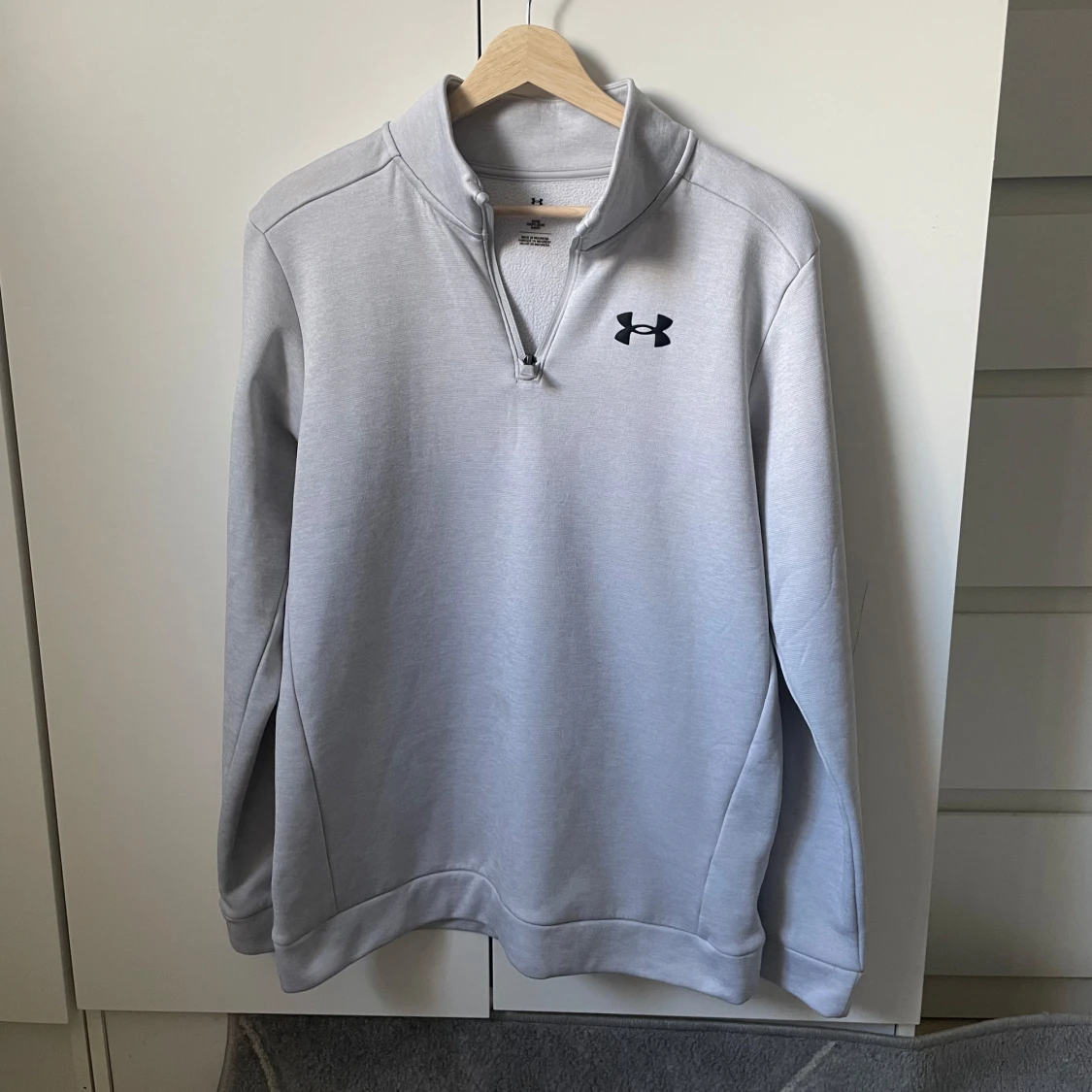 Ljusgrå halvzip tröja från Under Armour