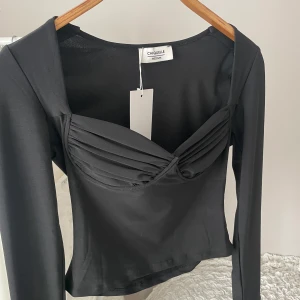 Topp från Chiquelle - Superfin svart topp från chiquelle, storlek 38/M. Prislapp kvar