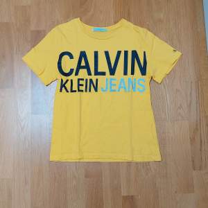 Yellow Calvin Klein boys t-shirt. 