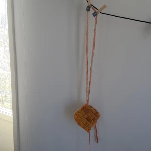 Crochet purse - My own work. Chrochet purse that could fit anything really. Your freestyle casette player, a small book, wallet and keys. All handcrafted. 