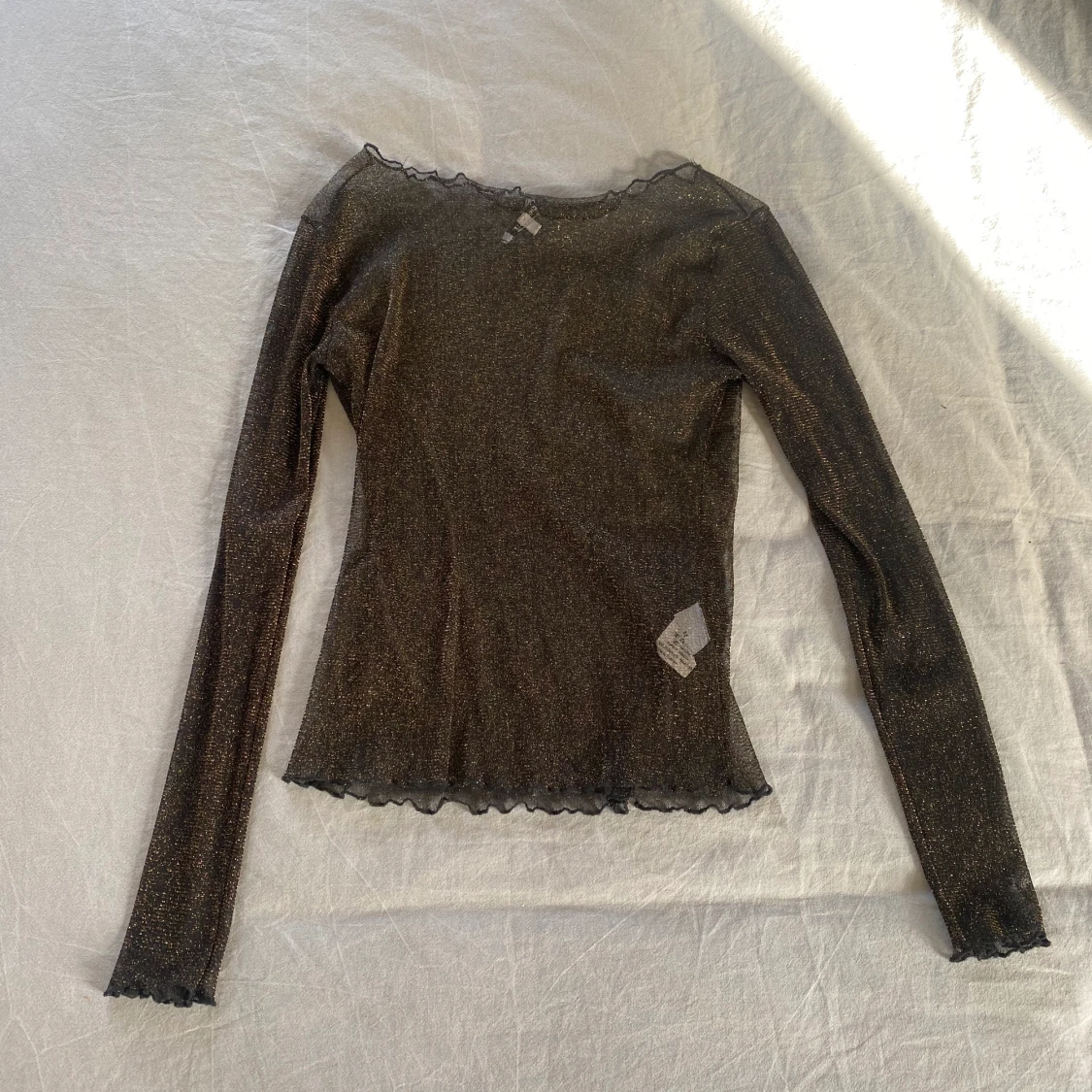 Svart och guldglittrig topp