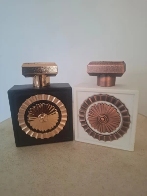 Nebras & Nebras Elixir  - Nebras: Top notes are Red Berries and Mandarin Orange; middle notes are Vanilla, Cacao and Rose; base notes are Sugar, Tonka Bean, Amber and Musk.                                                                Nebras Elixir: Top notes are Milk Candy and Whipped Cream; middle notes are Sugar Cane and Heliotrope; base notes are Vanilla, Ambroxan and Musk.