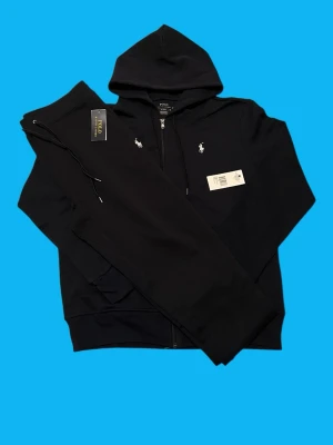 Ralph Lauren Tracksuit Size M (Navy) - Brand: Ralph Lauren Condition: Brand new  Color: Navy Size: Medium Measurements: Pants length 104cm waist 40-50 Zip hoodie length 68cm shoulder 48cm  • Message for questions or offers  • Cheaper if you buy more items • Delivery within 24hrs