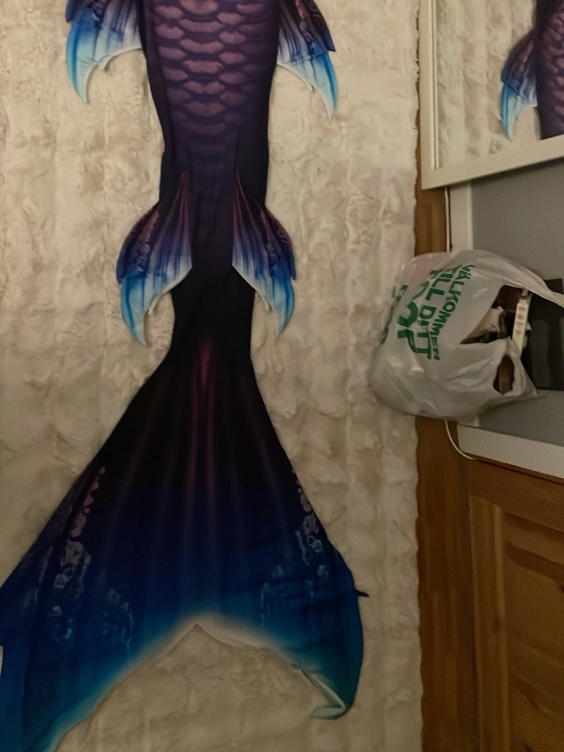 Blå-lila sjöjungfru fena