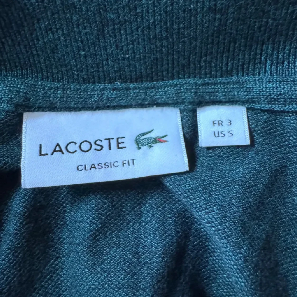Mörkgrön pikétröja från Lacoste - 1