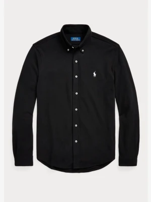 Svart skjorta från Polo Ralph Lauren - Klassisk svart skjorta från Polo Ralph Lauren i featherweight mesh. Skjortan har lång ärm, knappar framtill och den ikoniska vita logobrodyr på bröstet. Perfekt för dig som gillar stilrena och tidlösa plagg.