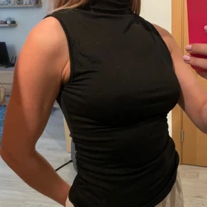 Svart polotopp  - Aldrig använt 