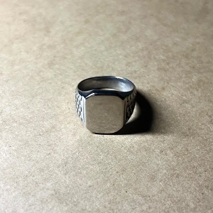 Silver Chrono Signet - A sleek fusion of timepiece design and modern minimalism. Size 9, stainless steel.