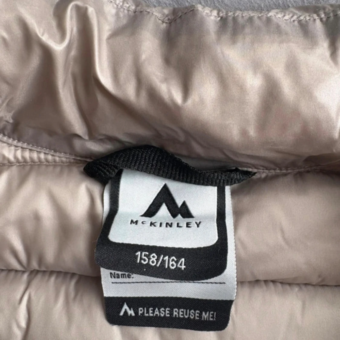 Beige pufferjacka från McKinley - 1