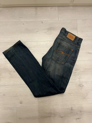 Nudie grim Tim jeans  - Hej! Säljer dessa feta archive nudie jeansen//knappen vid gylfen är bytt//fråga gärna! 