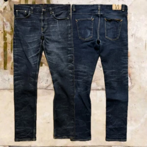Selvage Nudie LeanDean - Tjena! Säljer dessa riktigt snygga Selvage Leandean(slim), jeansen är i fint skick med snygga fades, materialet är lite slitet på vissa ställen, W36/L36, Midja-47,5/ Längd-108/ Benöppning-17, hör av dig vid funderingar!🙌