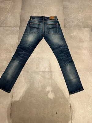 Nudie grim Tim - Tjena, säljer nu dessa riktigt snygga nudie grim Tim i Stl W30L32. Dom är i riktigt bra skick. Nypris 1600✅Vid minsta funderingar så är det bara att höra av sig//Allt gott