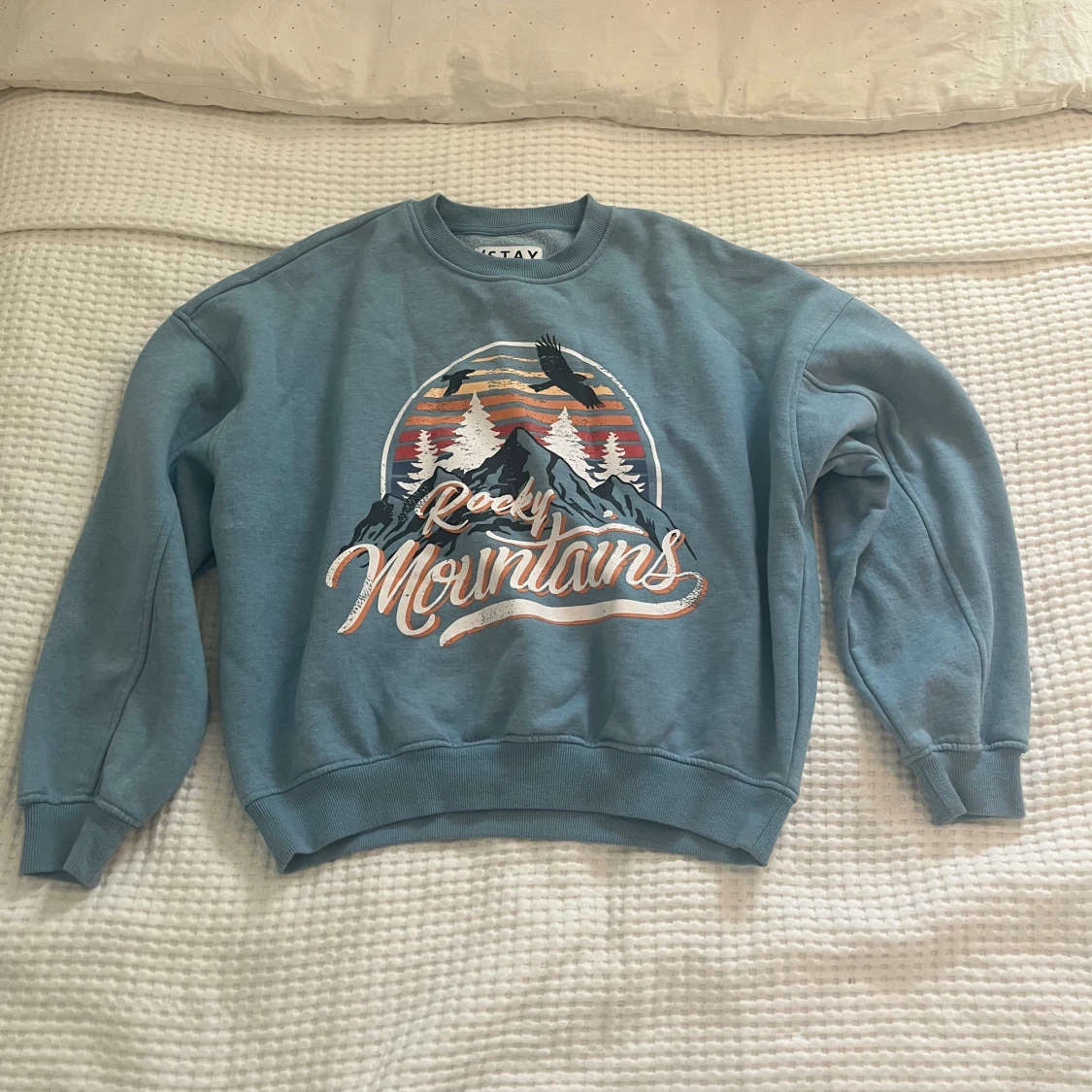 Ljusblå/turkos sweatshirt med tryck 