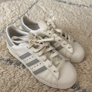 GRAY ADIDAS LA MARQUE AUX 3 BANDES - Im selling my one time used Adidas shoes. I sell them because they are too small for me. Like brand new but little dirt on the front. 