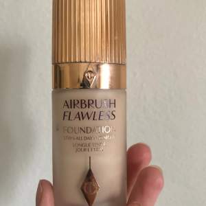Charlotte Tillbury Airbrush Flawless Foundation in shade 3 Neutral.  Full coverage foundation. More then half of the bottle left!