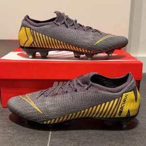 Nike Mercurial Vapor 12 Elite SG-PRO Anti-Clog Game Over - Grå/Gul   Skick:9/10  Storlek:44,5  Pris: 1999kr  Fler bilder eller funderingar kom priv