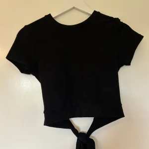 Topp med öppen rygg - Använd fåtal gånger 