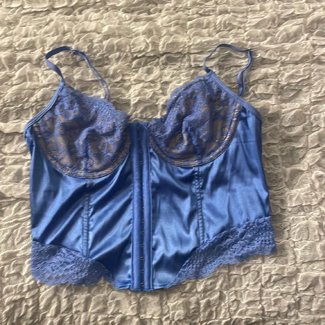 En blå korsett - 90